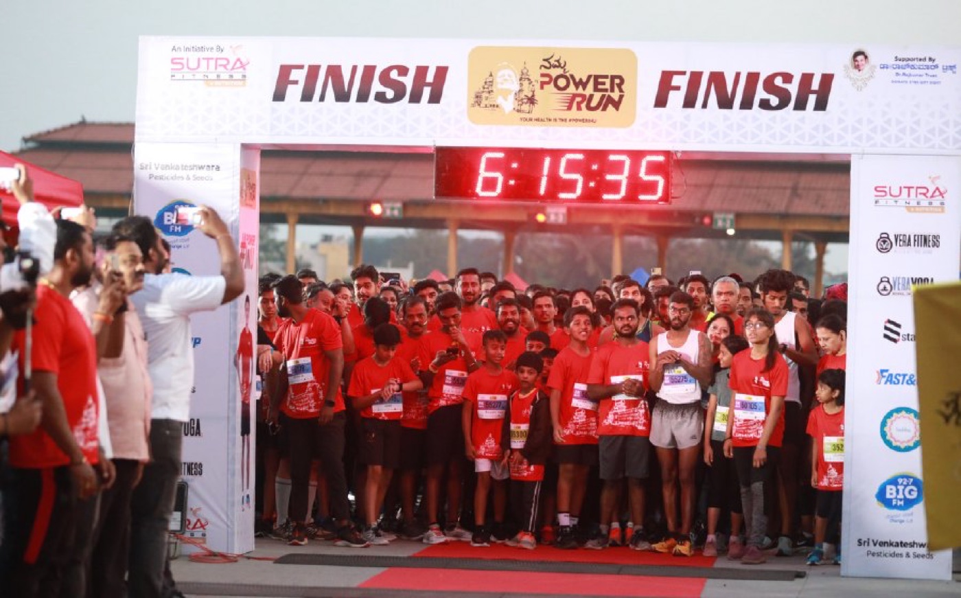 The Namma Power Run finish line, packed with runners in red